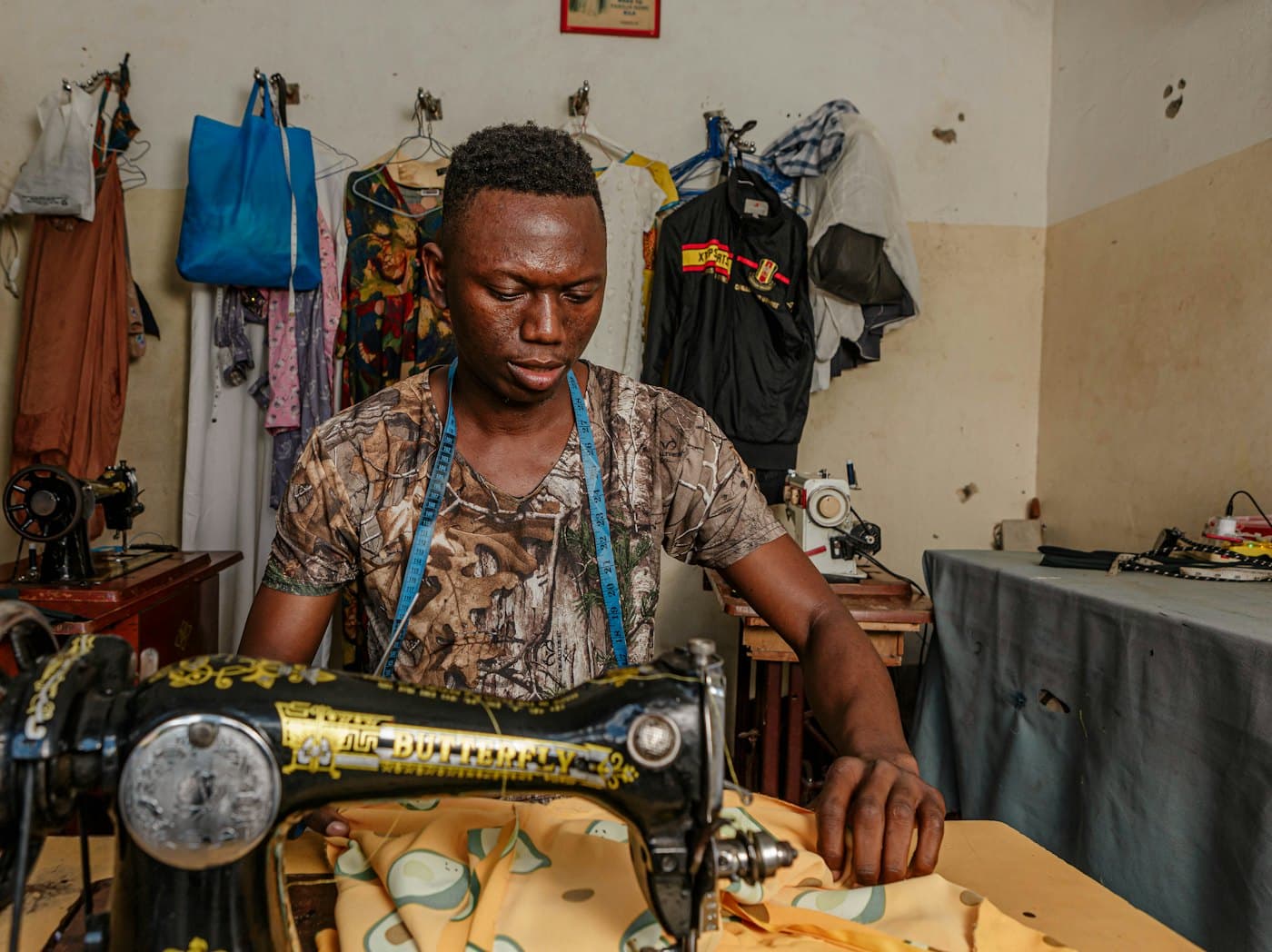 A tailor at work in his shop